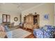 Comfortable living room featuring a ceiling fan, a hutch and seating around a tan rug at 4000 Cameron Blvd, Isle of Palms, SC 29451