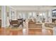 Spacious living and dining room with hardwood floors and floor to ceiling windows at 4000 Cameron Blvd, Isle of Palms, SC 29451