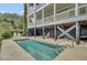 Backyard pool with lounge seating offers a private retreat for relaxation and enjoyment at 4000 Cameron Blvd, Isle of Palms, SC 29451