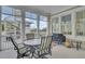 Enclosed porch features comfortable seating and outdoor grill at 4000 Cameron Blvd, Isle of Palms, SC 29451