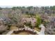 Aerial view of a beautiful property with a circular driveway and mature landscaping at 4140 Club Course Dr, North Charleston, SC 29420