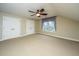 Spacious bedroom features a ceiling fan, two closets, and a large window at 4140 Club Course Dr, North Charleston, SC 29420