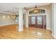 Inviting foyer featuring double doors, gleaming hardwood floors, and a tray ceiling at 4140 Club Course Dr, North Charleston, SC 29420