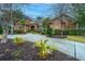 Charming brick home featuring meticulously landscaped front yard with verdant lawn and driveway at 4140 Club Course Dr, North Charleston, SC 29420