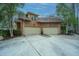 This home boasts an attached two-car garage with beige doors and brick veneer at 4140 Club Course Dr, North Charleston, SC 29420