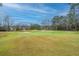 Picturesque view of lush golf course with rolling hills and manicured greens at 4140 Club Course Dr, North Charleston, SC 29420