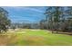 Beautiful view of golf course surrounded by mature trees and picturesque homes in a desirable golf community at 4140 Club Course Dr, North Charleston, SC 29420