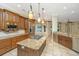 Modern kitchen with stainless steel appliances, granite countertops, and a center island at 4140 Club Course Dr, North Charleston, SC 29420