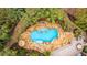 Overhead close up of the pool, featuring custom stone surround, tropical foliage, and plenty of room to relax at 4140 Club Course Dr, North Charleston, SC 29420