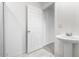 Bathroom with pedestal sink and open door at 4850 Habersham Ln, Summerville, SC 29485