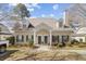 Charming townhouse exterior with neutral siding, dormer windows, covered entry and well-maintained landscaping at 4850 Habersham Ln, Summerville, SC 29485