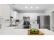 Bright kitchen features stainless steel appliances and white cabinets at 4850 Habersham Ln, Summerville, SC 29485