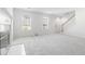 Spacious living room with a charming fireplace, new carpet, and two windows for ample natural light at 4850 Habersham Ln, Summerville, SC 29485