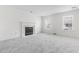 Bright and airy living room with fireplace, new neutral carpet, and two windows offering great natural light at 4850 Habersham Ln, Summerville, SC 29485