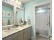 Stylish bathroom featuring a double vanity, modern fixtures, and a separate shower area at 502 Pontoon Rd, Huger, SC 29450