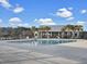 Outdoor community pool with plenty of seating and palm trees for shade at 502 Pontoon Rd, Huger, SC 29450