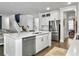 Modern kitchen with a large island, stainless steel appliances, and white cabinets at 502 Pontoon Rd, Huger, SC 29450