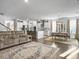Spacious living space featuring a comfortable sofa, kitchen and dining area with natural light at 502 Pontoon Rd, Huger, SC 29450