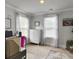 Home office with natural light, desk, computer, and white dresser, creating a functional workspace at 502 Pontoon Rd, Huger, SC 29450