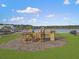 Lakeside playground with climbing structures, swings and slides for Gathering fun at 502 Pontoon Rd, Huger, SC 29450