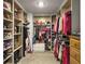 Spacious walk-in closet features custom shelving, hanging rods and plenty of room for storage at 502 Pontoon Rd, Huger, SC 29450