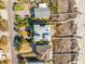 Aerial view showcasing pristine beach access via private walkways, complemented by meticulous landscaping at 511 W Ashley Ave, Folly Beach, SC 29439
