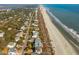 Expansive aerial view of charming coastal community with beaches, boardwalks and waterways at 511 W Ashley Ave, Folly Beach, SC 29439