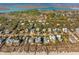Aerial view of charming beach community with lush trees, waterways and rows of beautiful beach homes at 511 W Ashley Ave, Folly Beach, SC 29439