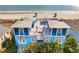 Stunning aerial view of a beachfront house with a rooftop patio at 511 W Ashley Ave, Folly Beach, SC 29439