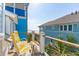 Comfortable balcony with patio chairs and a lovely view of the ocean at 511 W Ashley Ave, Folly Beach, SC 29439
