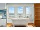 Spa-like bathroom featuring a soaking tub with scenic views offers a serene space to unwind and rejuvenate at 511 W Ashley Ave, Folly Beach, SC 29439