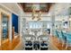 Expansive dining room with a stunning chandelier, a large table, and views of the ocean, ideal for elegant dinners at 511 W Ashley Ave, Folly Beach, SC 29439