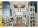 Elegant dining area featuring stylish white chairs, an open layout, and ample natural light, perfect for Gathering gatherings at 511 W Ashley Ave, Folly Beach, SC 29439