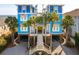 Spectacular beach house boasting a striking blue facade and grand entrance, elevated for breathtaking ocean views and coastal living at 511 W Ashley Ave, Folly Beach, SC 29439