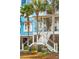 Charming two-story home with landscaped yard and beautiful curb appeal at 511 W Ashley Ave, Folly Beach, SC 29439