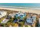 Stunning beachfront home with lush landscaping, multiple decks, and direct access to the sandy beach at 511 W Ashley Ave, Folly Beach, SC 29439