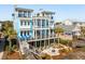 Eye-catching coastal residence with multiple decks and inviting outdoor spaces, creating an ideal setting for seaside relaxation and enjoyment at 511 W Ashley Ave, Folly Beach, SC 29439