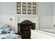 Bright main bedroom featuring fireplace, chair, and hardwood floors at 511 W Ashley Ave, Folly Beach, SC 29439