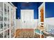 Charming foyer with beautiful hardwood floors, a decorative chair, and a glass display cabinet, offering a warm welcome at 511 W Ashley Ave, Folly Beach, SC 29439