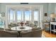 Cozy sitting area with seating, ocean views, and wet bar, perfect for relaxing and entertaining at 511 W Ashley Ave, Folly Beach, SC 29439