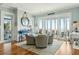 Well-lit sitting area with views of the ocean and access to an outdoor porch at 511 W Ashley Ave, Folly Beach, SC 29439