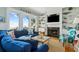 Relaxing living room with ocean views, fireplace, custom built-ins, and comfortable furniture at 511 W Ashley Ave, Folly Beach, SC 29439