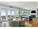 Bright living room with hardwood floors, fireplace, custom shelving and ocean views at 511 W Ashley Ave, Folly Beach, SC 29439