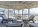 Beautiful outdoor patio with views of the beach and ocean and comfortable seating at 511 W Ashley Ave, Folly Beach, SC 29439