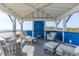 Comfortable seating on a rooftop patio, with views of the ocean at 511 W Ashley Ave, Folly Beach, SC 29439