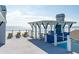 Lovely rooftop patio with seating and beachfront views at 511 W Ashley Ave, Folly Beach, SC 29439