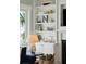 Living room built-in shelves next to fireplace with beach-themed decor and a large picture window at 511 W Ashley Ave, Folly Beach, SC 29439
