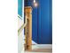 Close-up of staircase with wood banister and post against a stylish blue paneled wall at 511 W Ashley Ave, Folly Beach, SC 29439