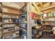 Well-organized storage room with lots of wooden shelving at 511 W Ashley Ave, Folly Beach, SC 29439