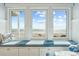 Inviting window seat with ocean views and custom cushions offers a tranquil space to relax and enjoy the scenery at 511 W Ashley Ave, Folly Beach, SC 29439